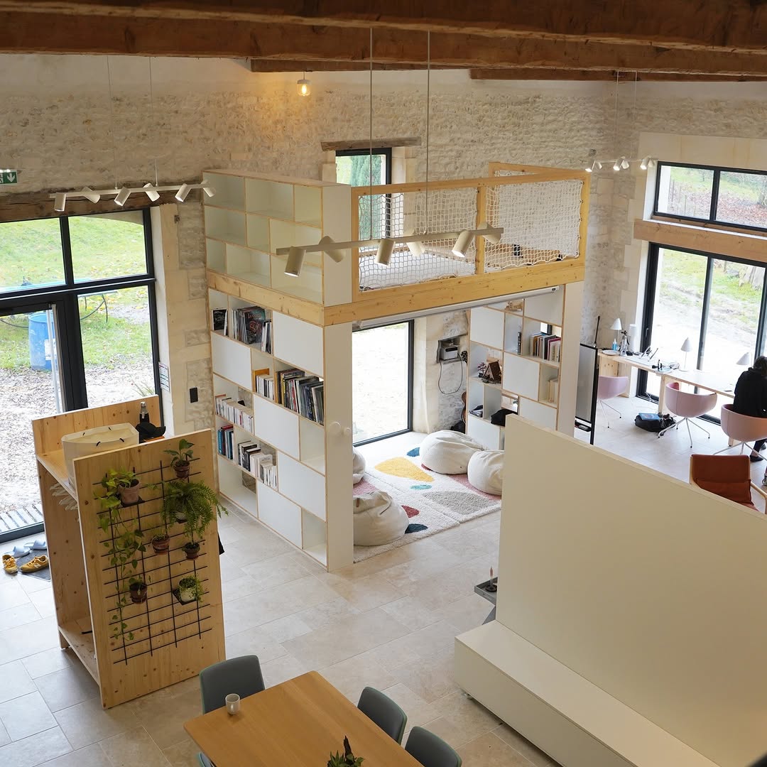 Interior — library, mezzanine, coworking